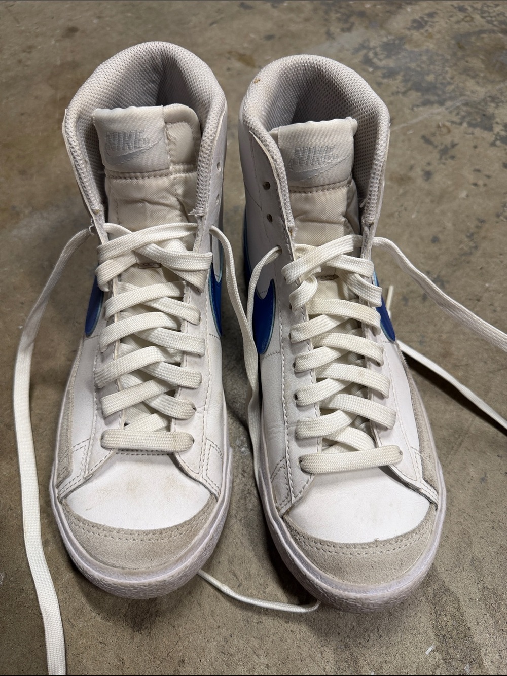 Nike White High-Top Sneakers with Blue Swoosh